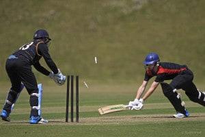 George Garton of Hurstpierpoint is stumped for 41 runs by Sam Sweetland of Wellington during the 1st semi final of the National Schools Twenty20 competition 2015 between Hurstpierpoint and Wellington at Arundel Castle Cricket Club, Arundel, West Sussex, England on 3 July 2015. Photo by Sarah Ansell.